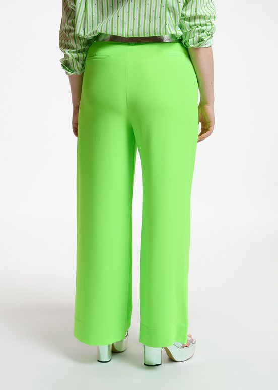 Fluogroene broek met brede pijpen