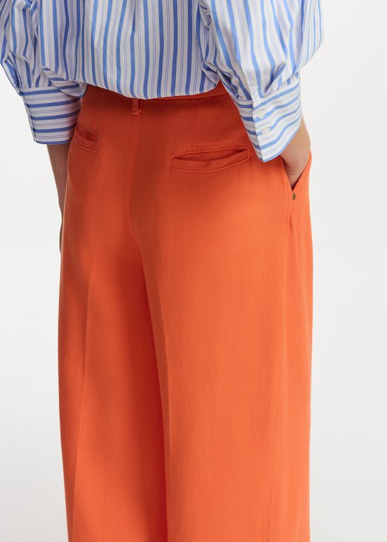 Oranje broek met brede pijpen