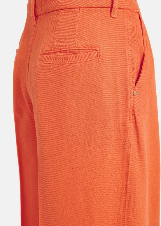 Oranje broek met brede pijpen