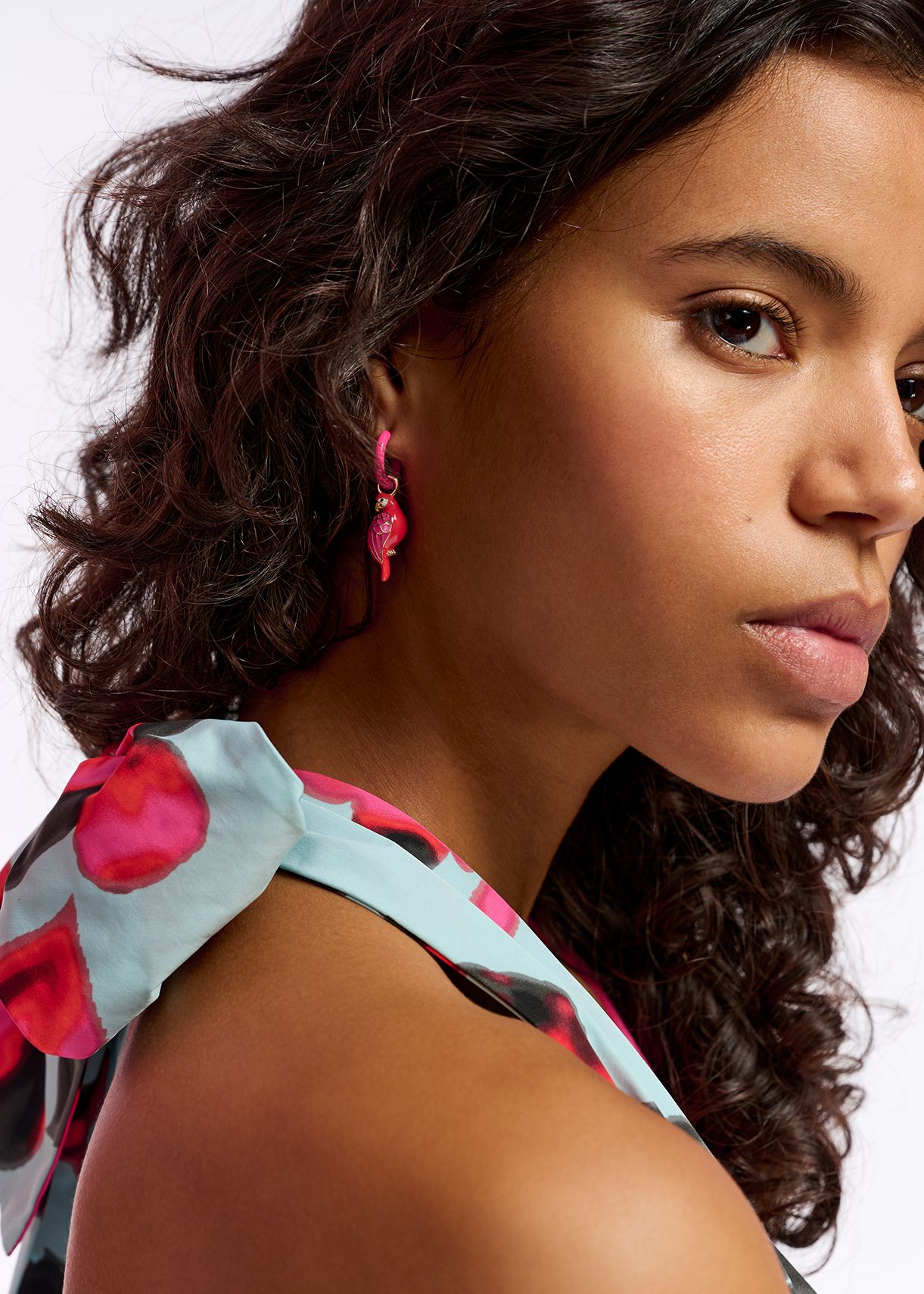 Neon pink hoop earrings with parrot and lime pendants