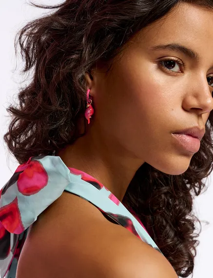 Neon pink hoop earrings with parrot and lime pendants