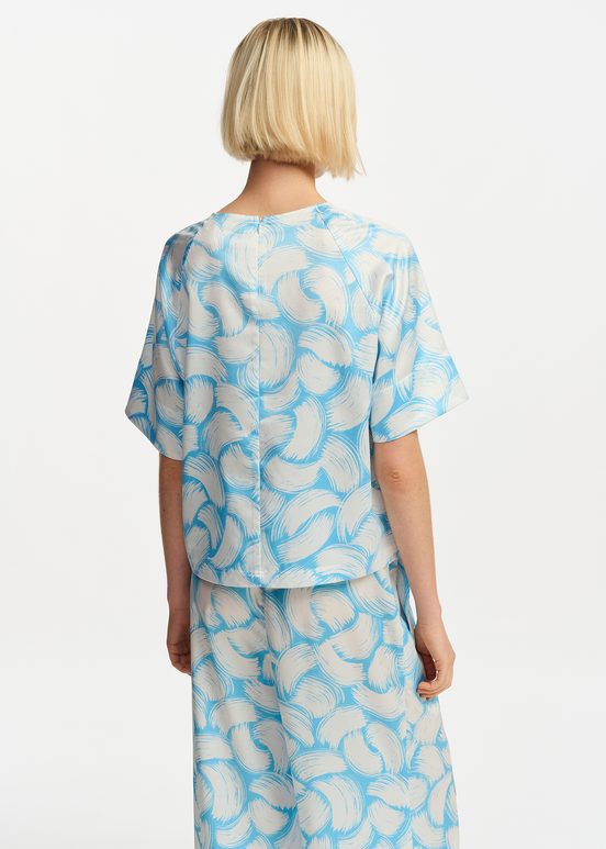 Blauwe en gebroken witte oversized top met print