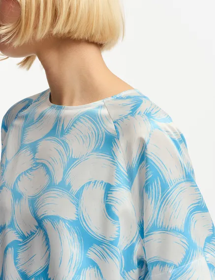 Blauwe en gebroken witte oversized top met print