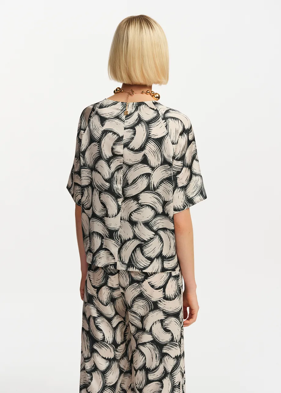Black and off-white abstract-print oversized top