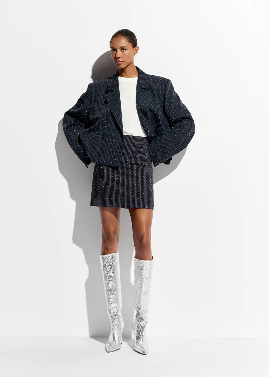 Navy blue pinstriped mini skirt with rhinestone embellishments