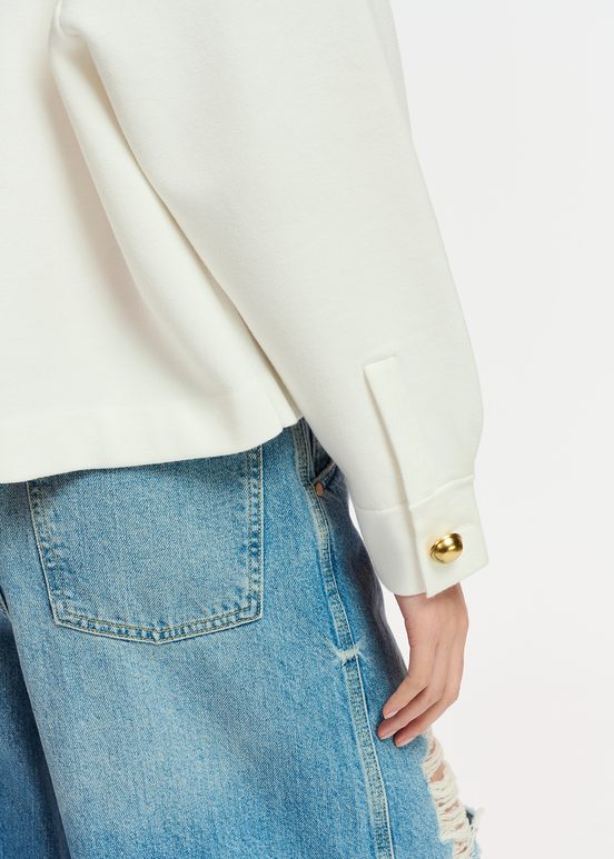 Veste en tricot blanc cassé à poches plaquées en faux cuir