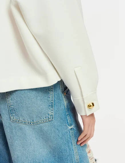 Veste en tricot blanc cassé à poches plaquées en faux cuir