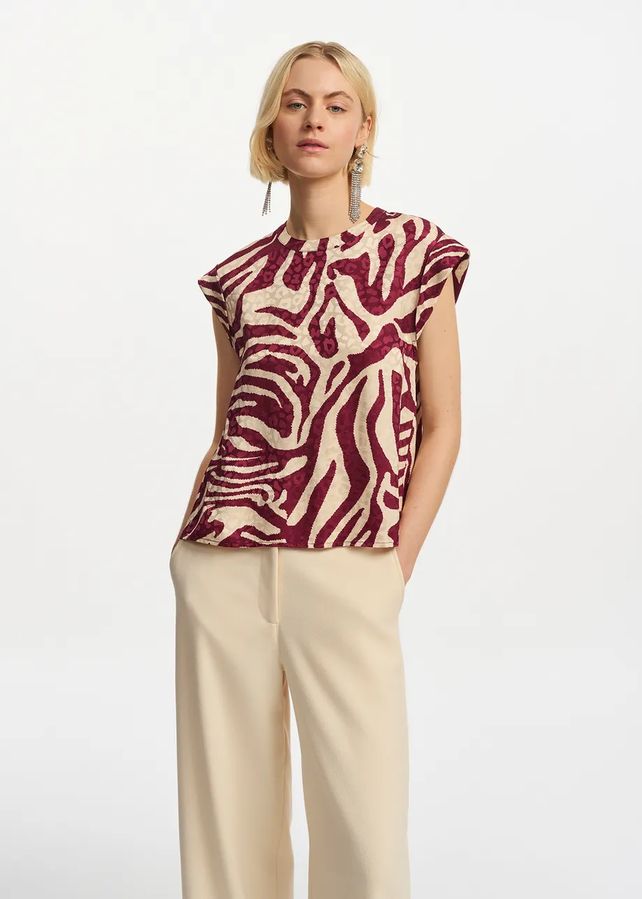 Burgundy and ecru zebra-print top