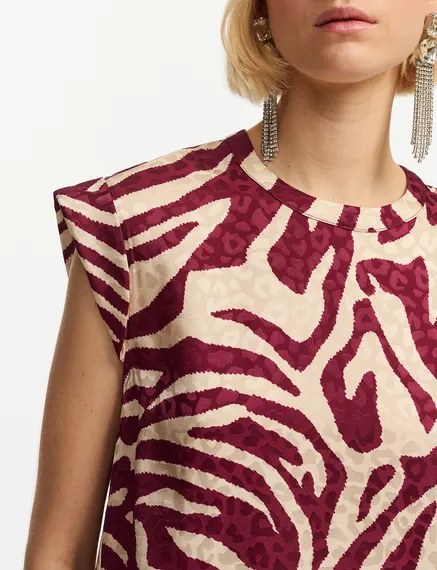 Burgundy and ecru zebra-print top