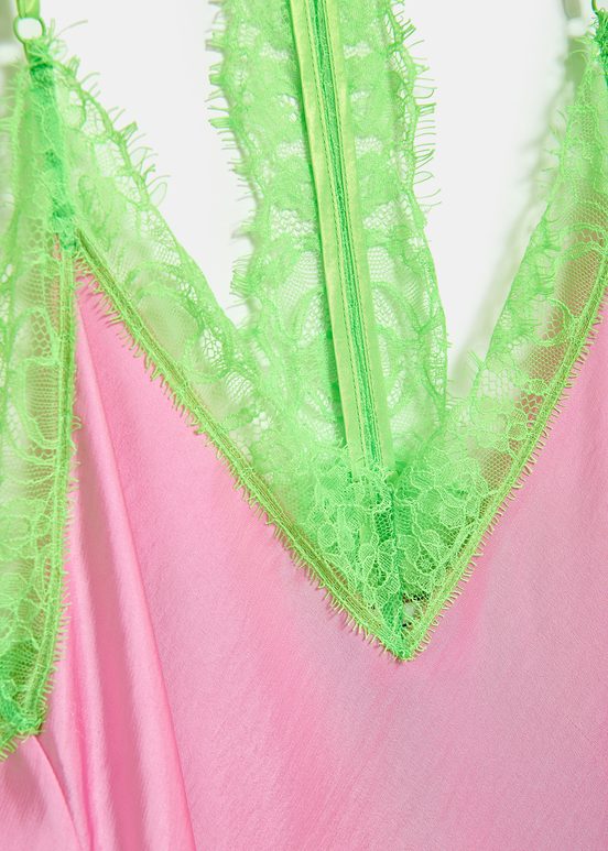 Light pink slip dress with neon green lace trimmings