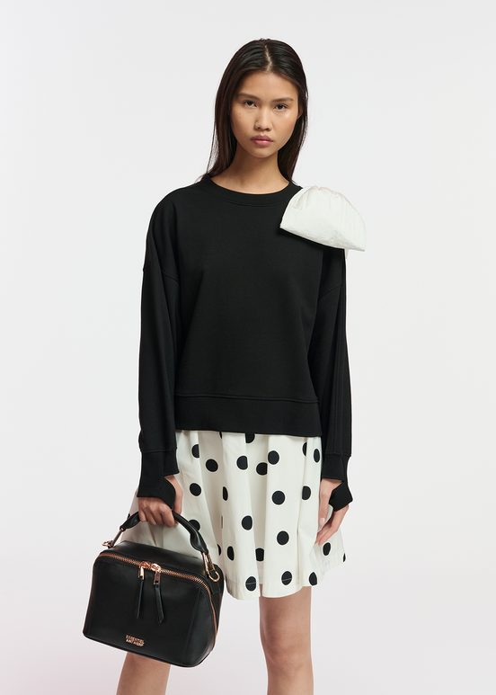 Black sweatshirt with white bow