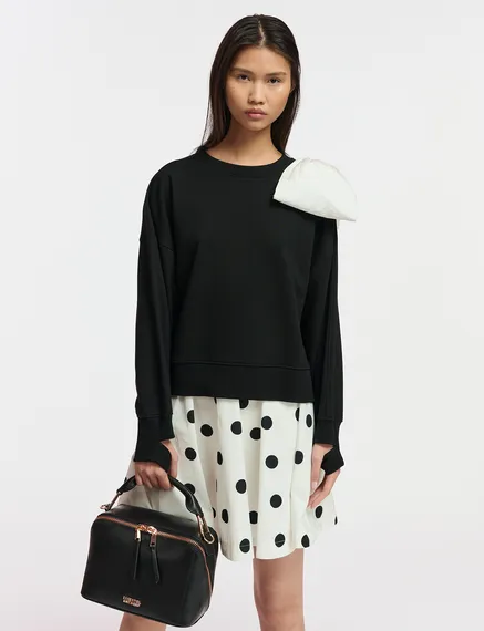 Black sweatshirt with white bow