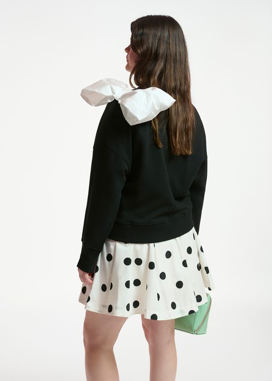 Black sweatshirt with white bow