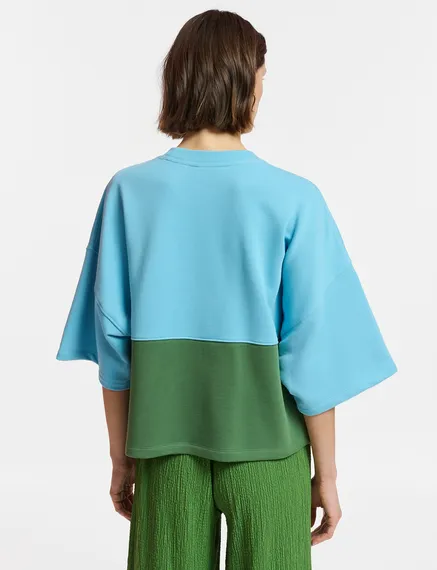 Blauwe en groene sweater met korte mouwen en pailletten