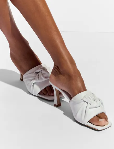 White knot-detailed leather mules