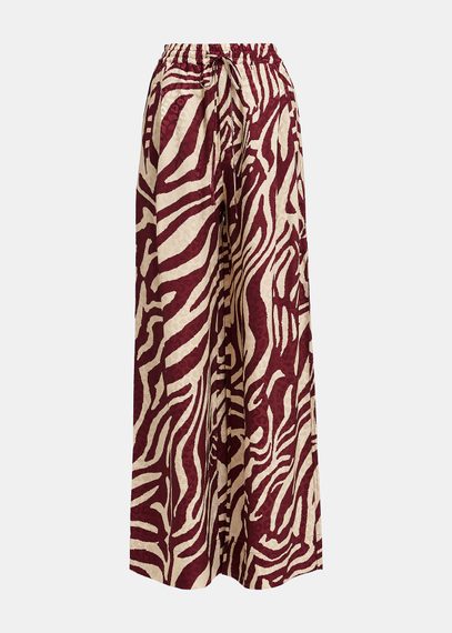 Burgundy and ecru zebra-print wide-leg pants