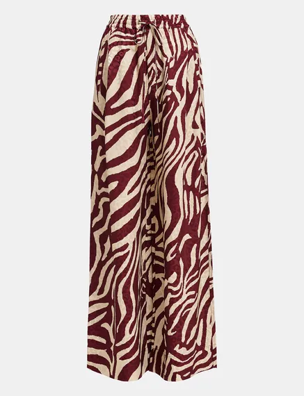 Burgundy and ecru zebra-print wide-leg pants