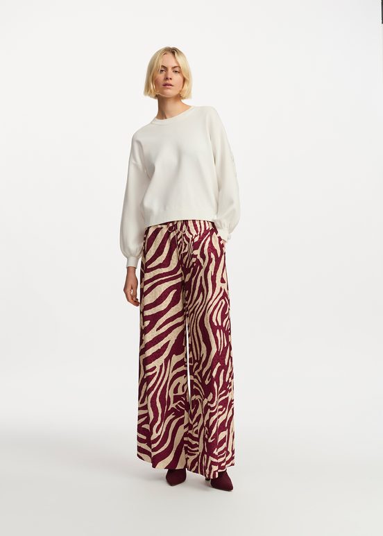 Burgundy and ecru zebra-print wide-leg pants