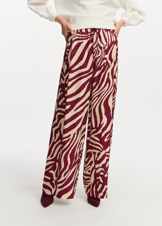 Burgundy and ecru zebra-print wide-leg pants