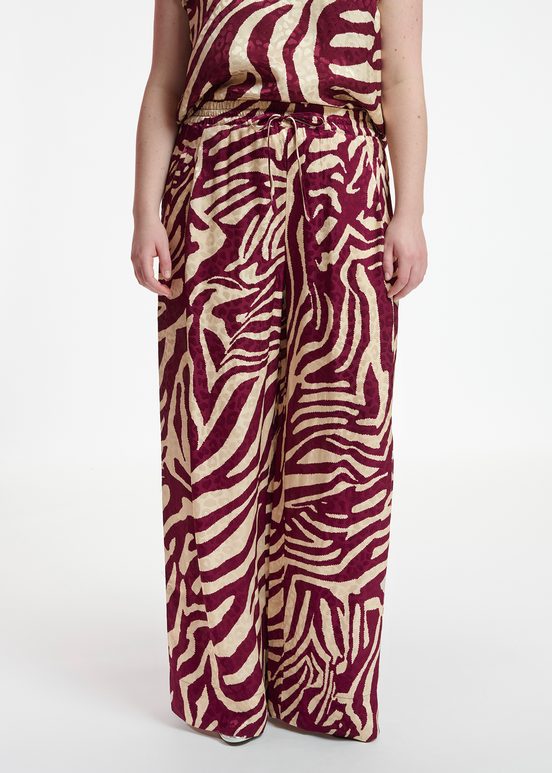 Burgundy and ecru zebra-print wide-leg pants