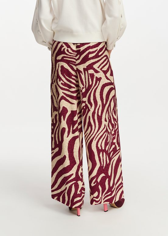 Burgundy and ecru zebra-print wide-leg pants