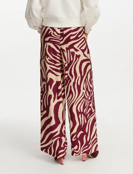 Burgundy and ecru zebra-print wide-leg pants