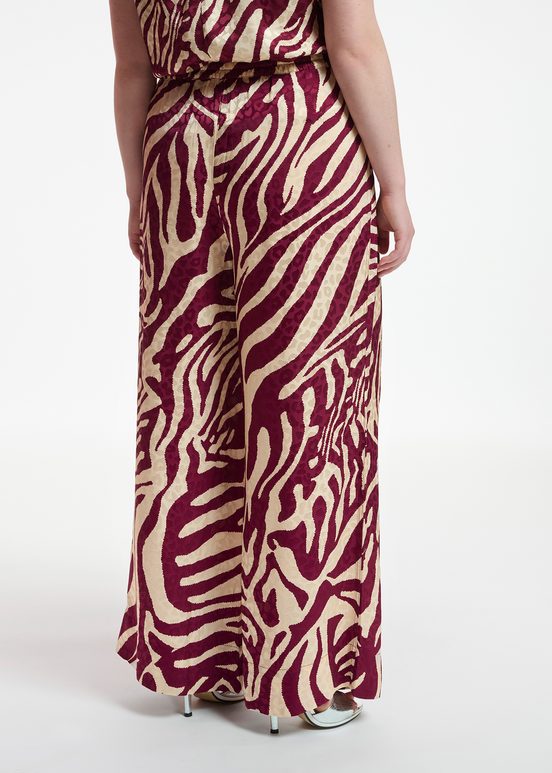 Burgundy and ecru zebra-print wide-leg pants