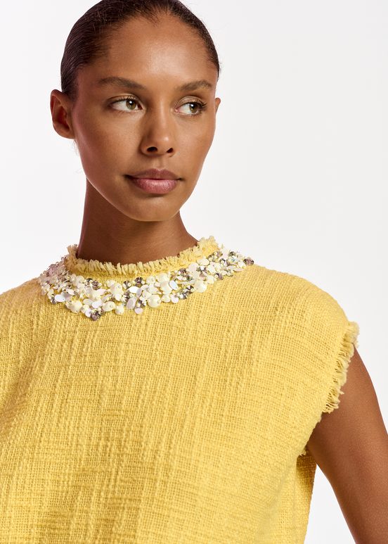 Yellow sleeveless top with sequin and bead-embellished neckline