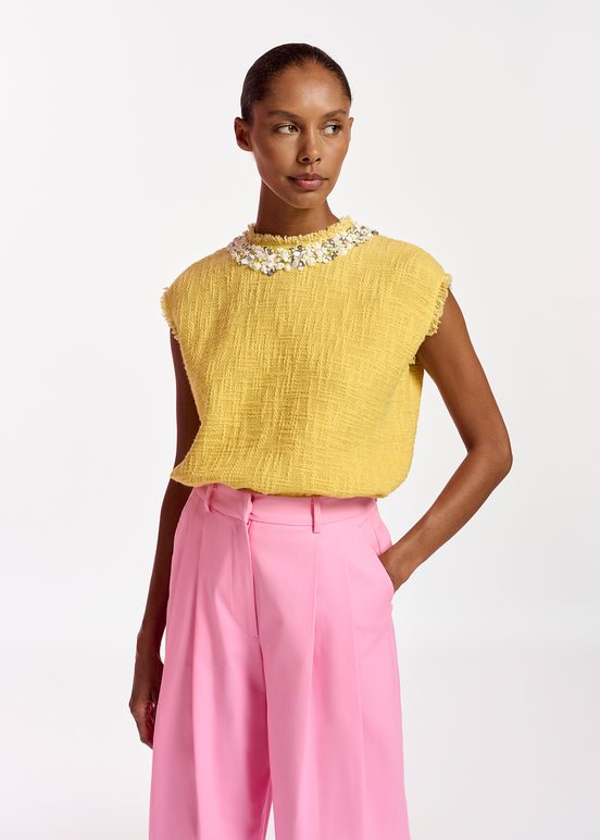 Yellow sleeveless top with sequin and bead-embellished neckline