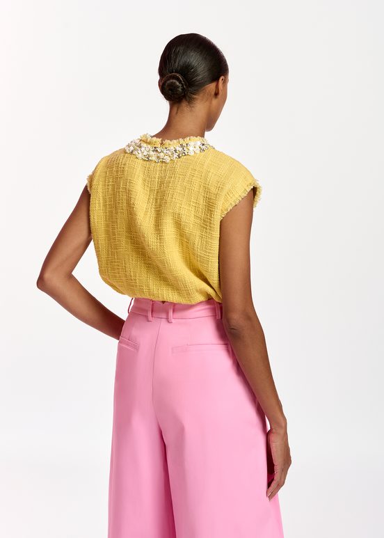 Yellow sleeveless top with sequin and bead-embellished neckline