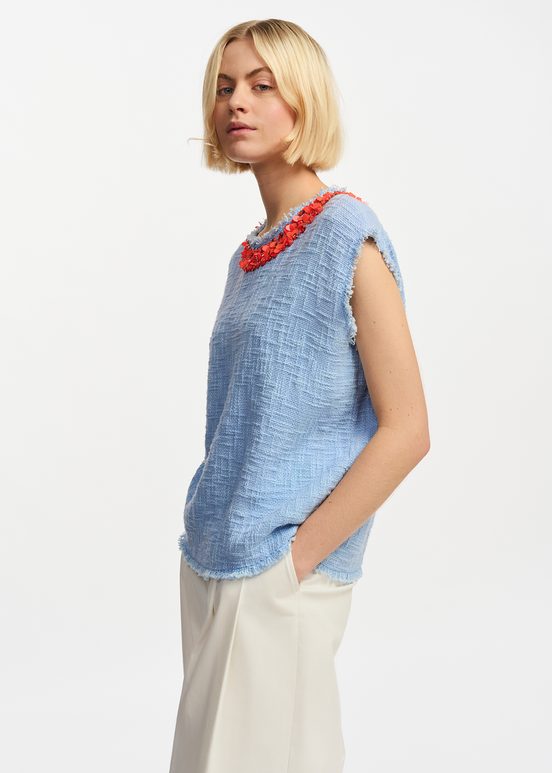 Light blue sleeveless top with sequin and bead-embellished neckline