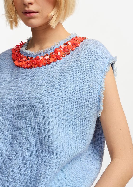 Light blue sleeveless top with sequin and bead-embellished neckline