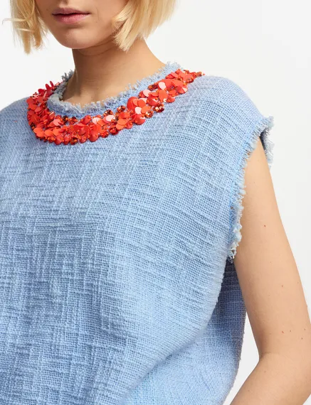 Light blue sleeveless top with sequin and bead-embellished neckline