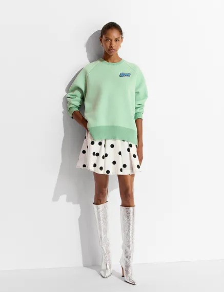 Mint green sweatshirt with bead embellishment