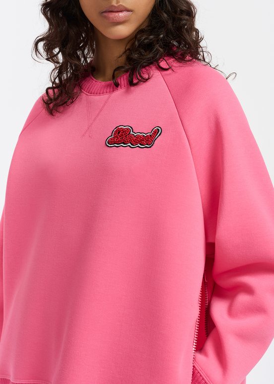 Pink sweatshirt with bead embellishment