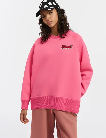 Pink sweatshirt with bead embellishment