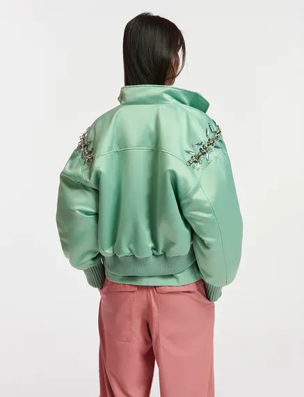 Mint green satin bomber jacket with rhinestone embellishments