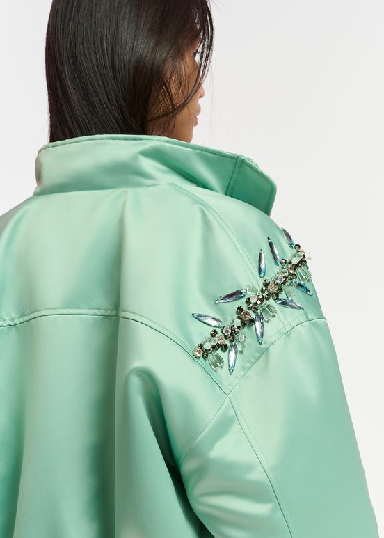 Mint green satin bomber jacket with rhinestone embellishments