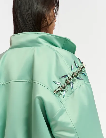 Mint green satin bomber jacket with rhinestone embellishments