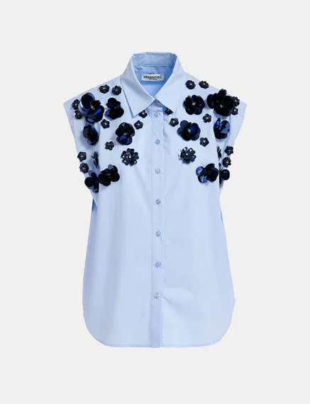 Light blue sleeveless cotton shirt with embellishments