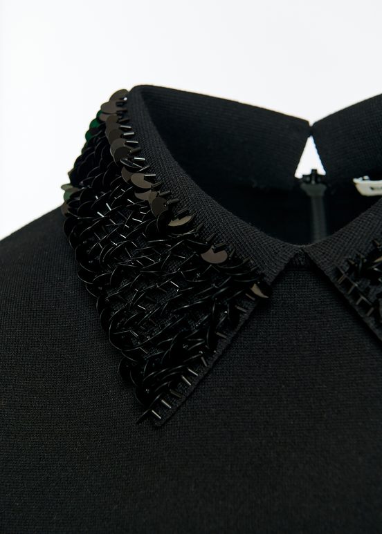 Black top with sequin-embellished collar