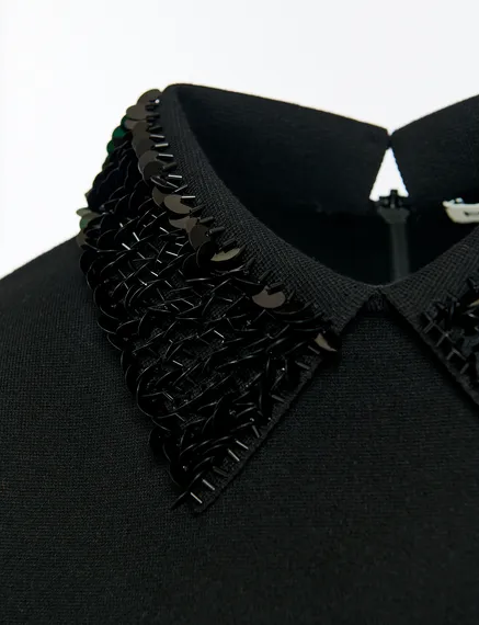 Black top with sequin-embellished collar