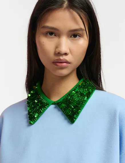 Blue top with green sequin-embellished collar