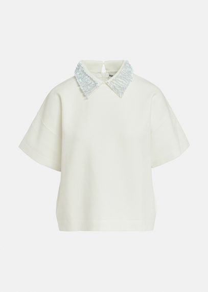 Off-white top with sequin-embellished collar