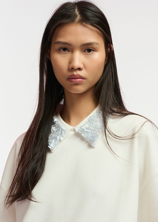 Off-white top with sequin-embellished collar