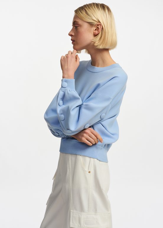 Light blue knitted sweater with buttoned sleeves