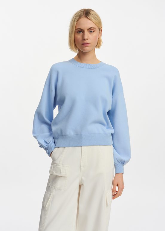 Light blue knitted sweater with buttoned sleeves