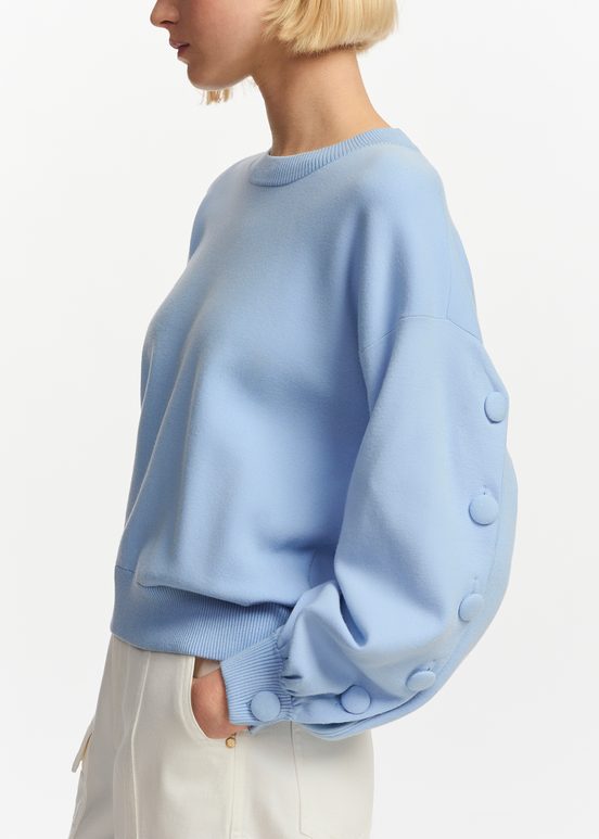 Light blue knitted sweater with buttoned sleeves