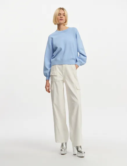 Light blue knitted sweater with buttoned sleeves