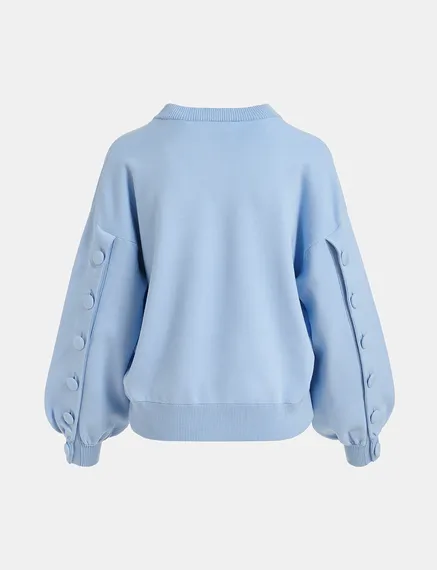 Light blue knitted sweater with buttoned sleeves